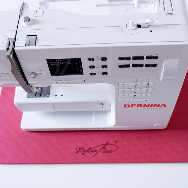 A Bernina sewing machine on the MadamSew Sewing Machine Muffling Mat