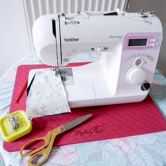 A Brother sewing machine on the MadamSew Sewing Machine Muffling Mat